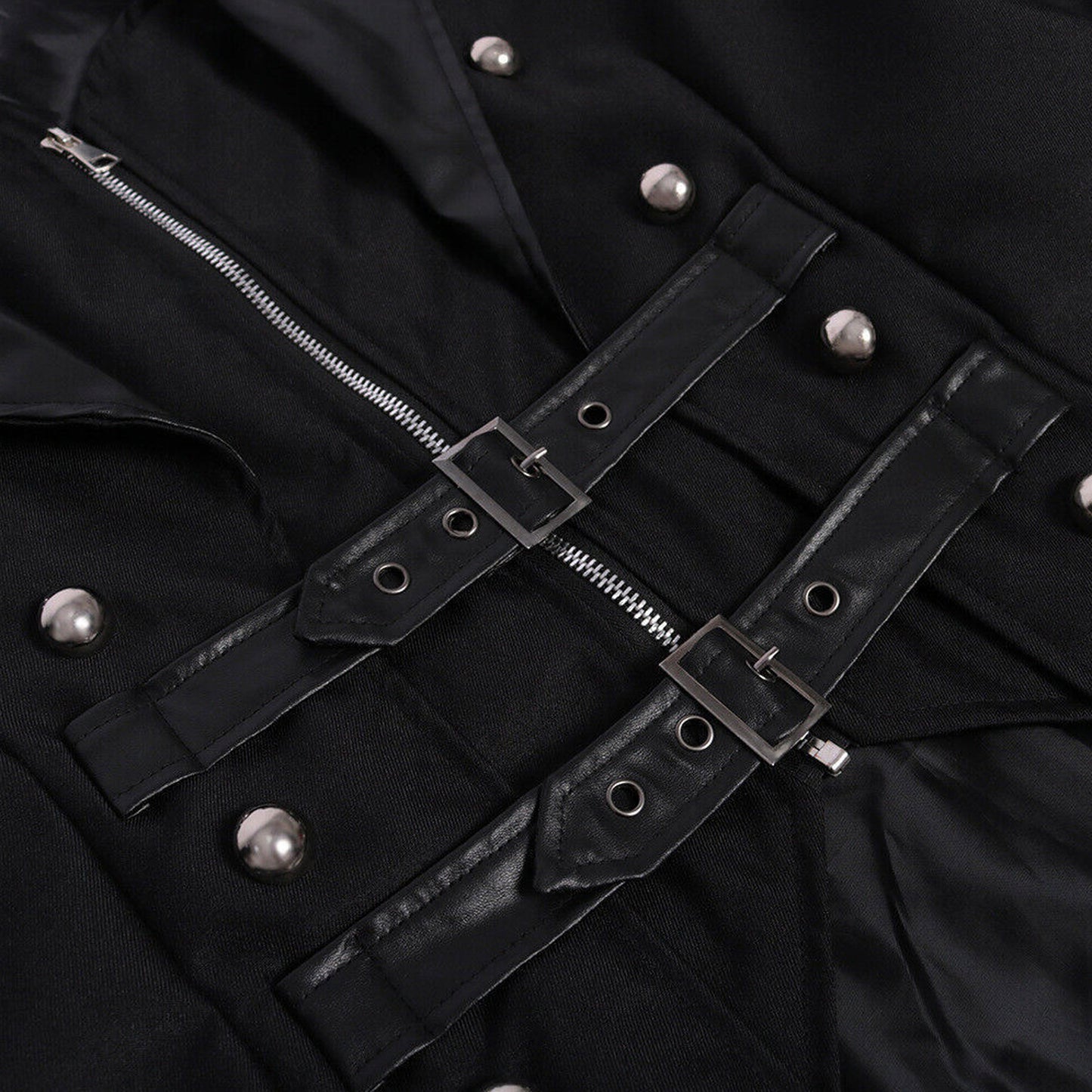 Close-up of a black jacket with silver buttons and zippers