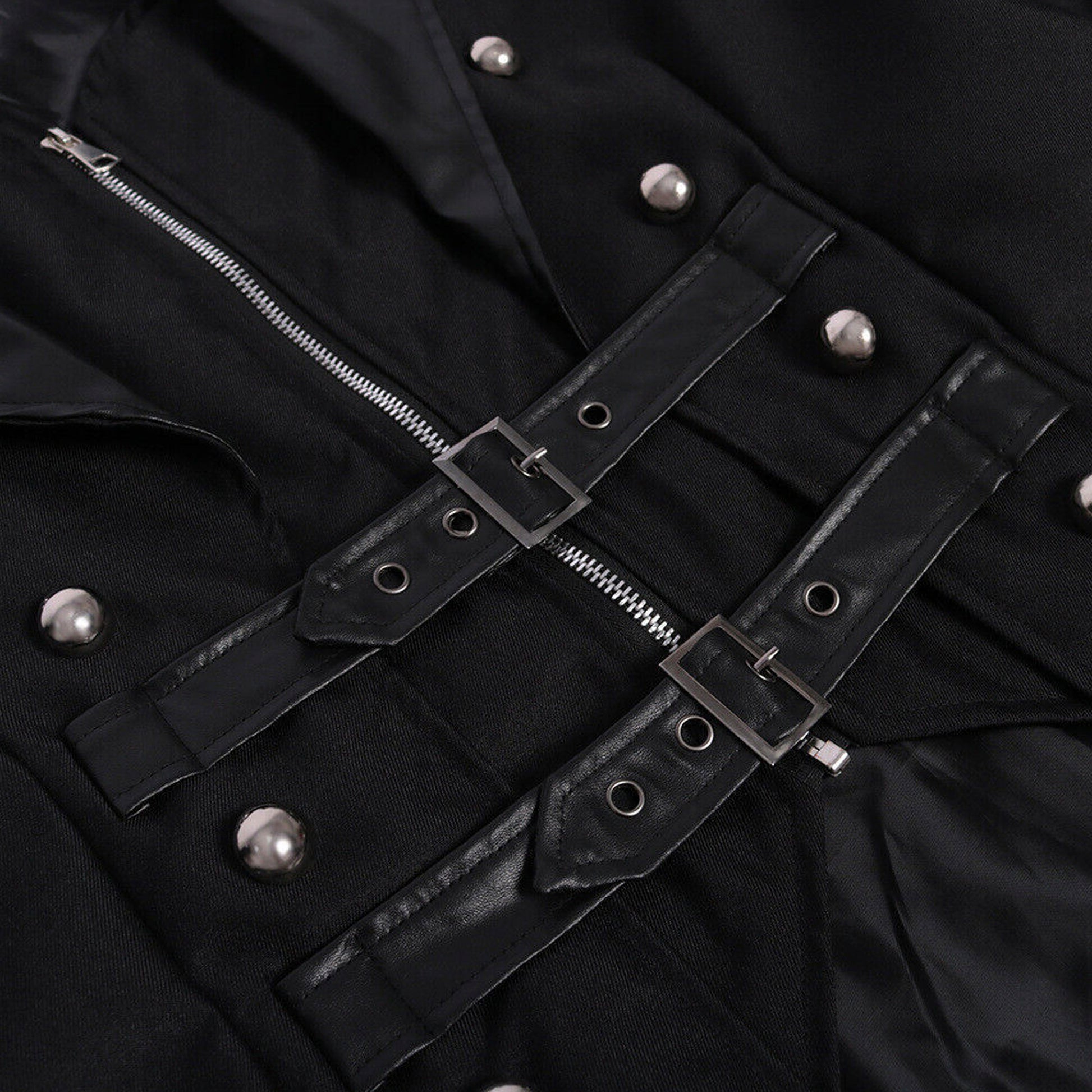 Close-up of a black jacket with silver buttons and zippers